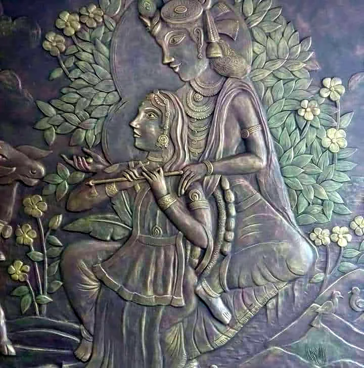 Relief of Krishna playing the flute with a seated figure among flowers