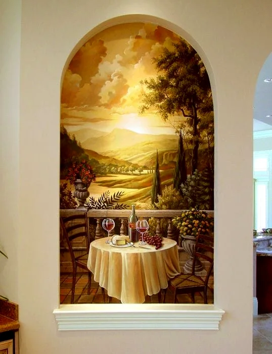 Arched alcove painted with a sunlit countryside landscape above a draped table
